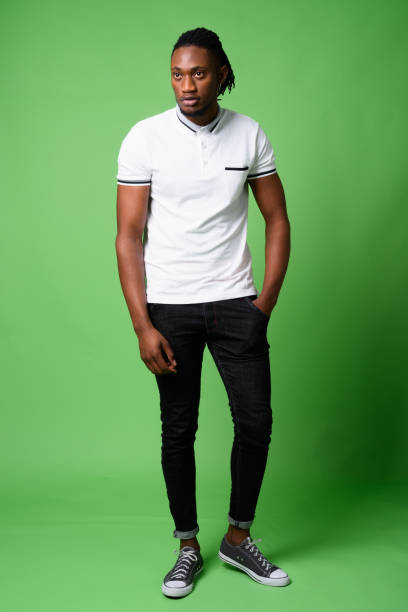 istock Young handsome African man from Kenya against green background 865585060