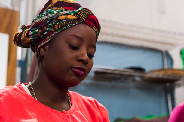 Photo of African woman working in traditional clothing