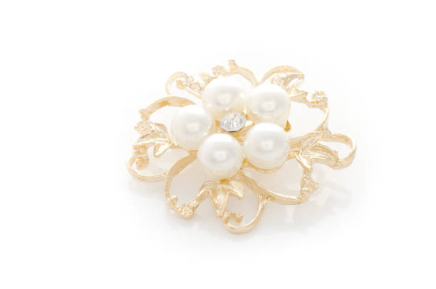 istock gold brooch flower with pearl isolated on white 865589986