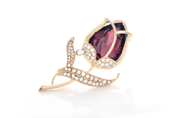 istock gold brooch rose bud with crimson stone and diamonds isolated on white 865590004