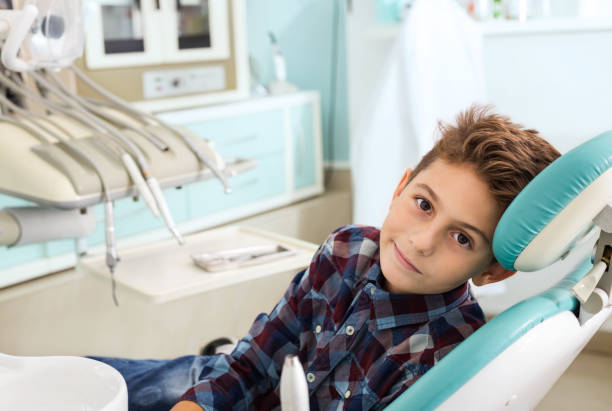 Boy in dentist office stock photo