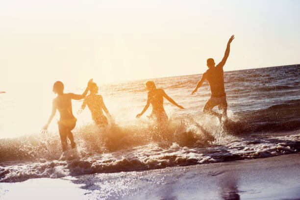 istock Happy friends beach vacations holiday 865596150