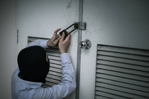 istock robber in black mask. robbery and crime concept. 865596478