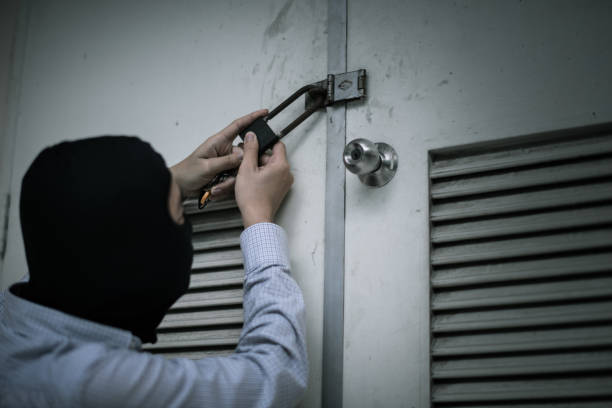 istock robber in black mask. robbery and crime concept. 865599610