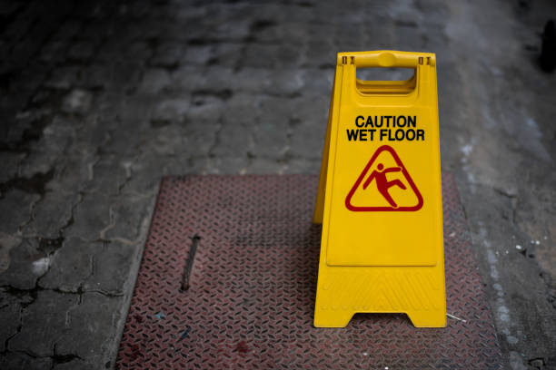 istock Close up yellow caution wet floor sign with copy space for text. 865603882