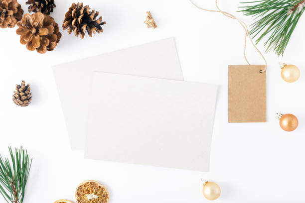 istock Blank cards with price tag and decorations on white background. Christmas background top view 865604090