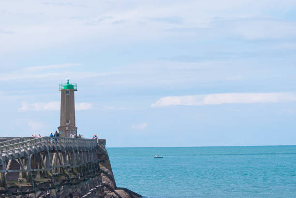 istock Lighthouse with sea scape in sunnny day 865604512
