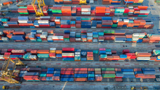 istock container,container ship in import export and business logistic,By crane,Trade Port , Shipping,cargo to harbor.Aerial view,Water transport,International,Shell Marine,transportation,logistic,trade,port 865604886