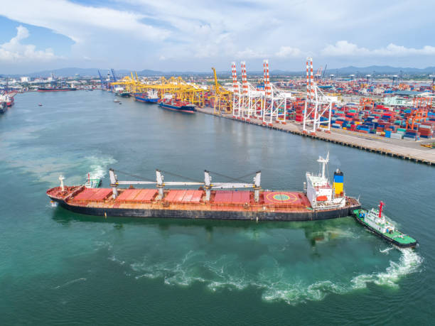 istock container,container ship in import export and business logistic,By crane,Trade Port , Shipping,cargo to harbor.Aerial view,Water transport,International,Shell Marine,transportation,logistic,trade,port 865604934