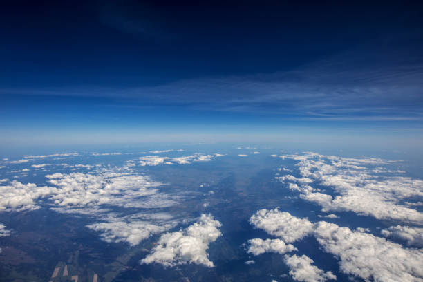 istock High altitude view between sky and space , in to the dark 865608080