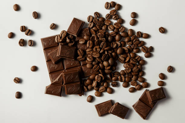 istock Chocolate and coffee on a white background. Top view 865611566