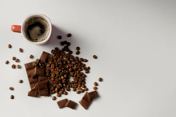 istock cup of fragrant coffee, beans coffee and chocolate on white background 865611668