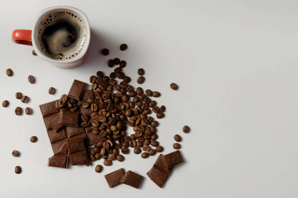 istock cup of fragrant coffee, beans coffee and chocolate on white background 865611790