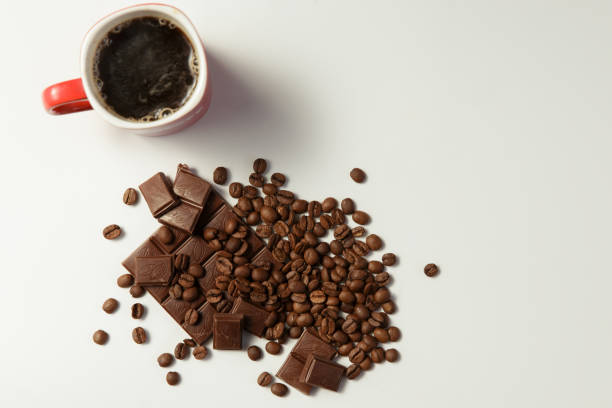 istock cup of fragrant coffee, beans coffee and chocolate on white background 865611950