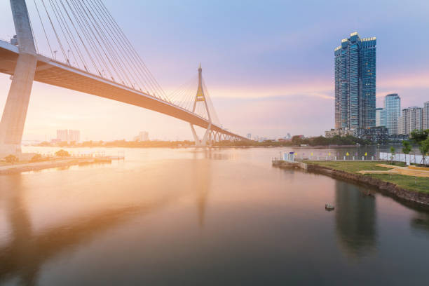istock Sunset suspension bridge crossing Bangkok river 865612016
