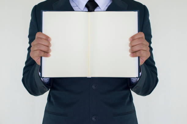 istock Business man holding the book 865612630