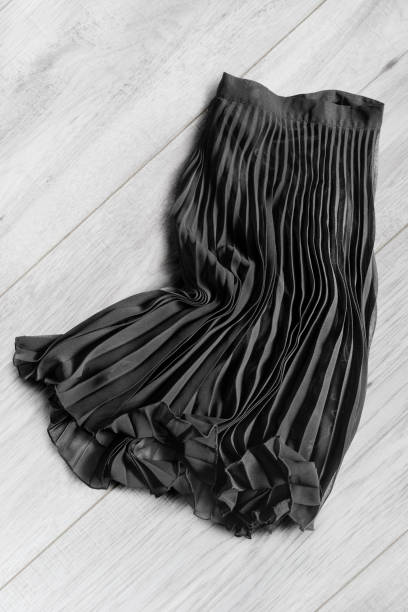 istock Skirt on wooden background 865619438