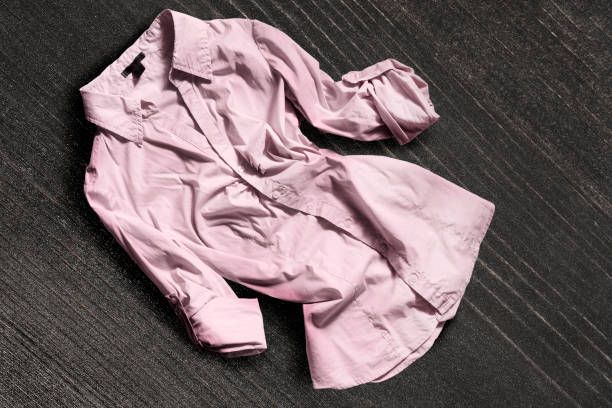 istock Shirt on wooden background 865619500