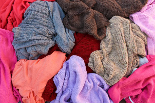 istock Pile of carelessly warm scattered clothes. 865619624