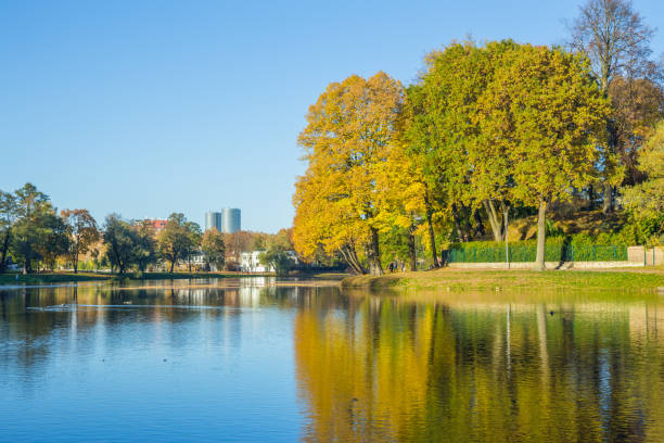 istock Pond in Riga, district agenskalsns. Autumn, yellow tree leaves, lake and reflection. 2017 865623644
