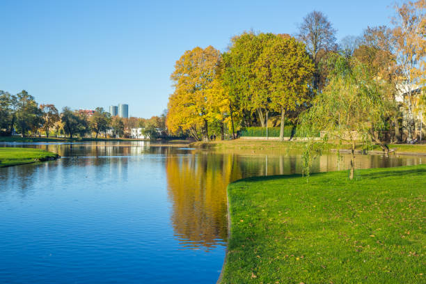 istock Pond in Riga, district agenskalsns. Autumn, yellow tree leaves, lake and reflection. 2017 865623656