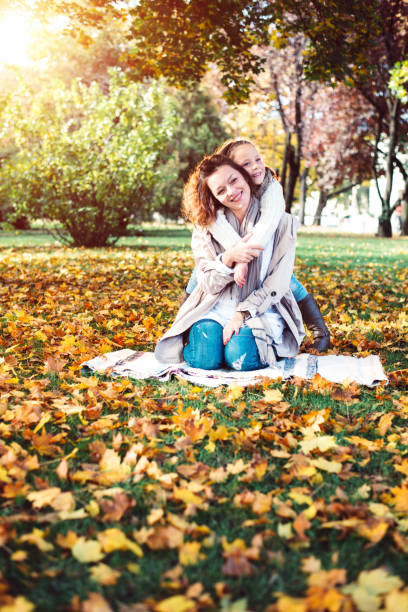 istock Mother and daughter in park 865623730