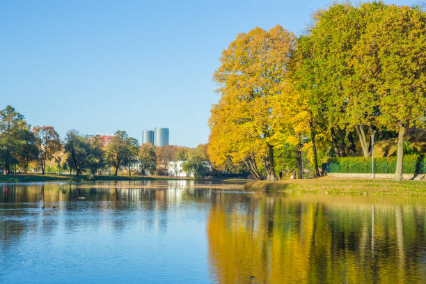 istock Pond in Riga, district agenskalsns. Autumn, yellow tree leaves, lake and reflection. 2017 865623746
