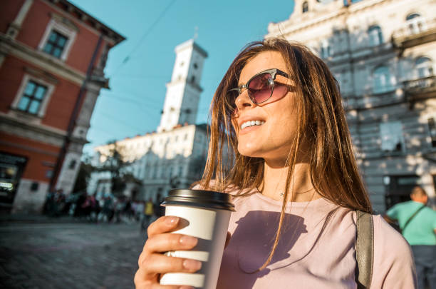 istock Hipster Girl in Sunglasses Holding Coffee Cup 865624000