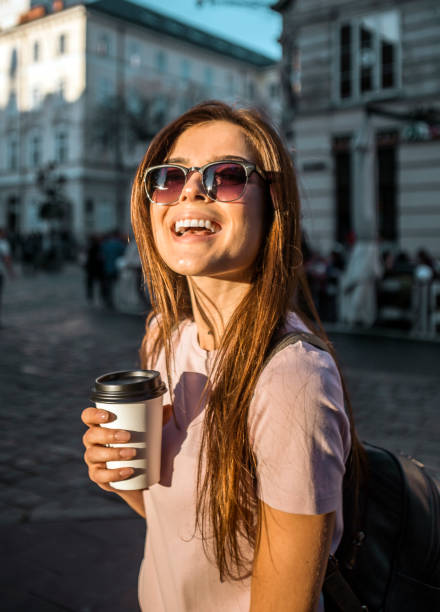 istock Hipster Girl in Sunglasses Holding Coffee Cup 865624084