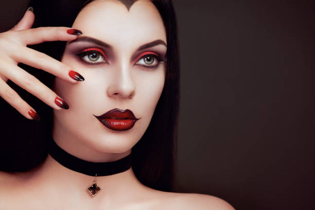 Halloween vampire woman portrait Halloween Vampire Woman portrait. Beautiful Glamour Fashion Sexy Vampire Lady with long dark Hair, beauty make up and Costume vampire woman stock pictures, royalty-free photos & images