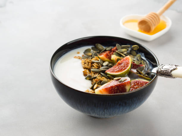 istock Healthy breakfast yogurt bowl with granola and fig 865624322