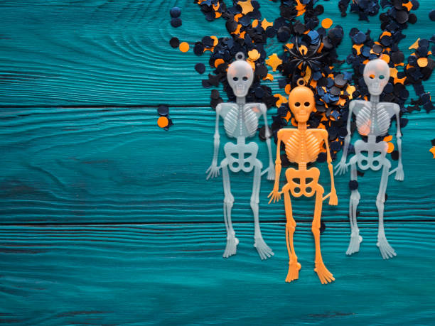 istock Halloween party decorations skeleton on dark green 865624582