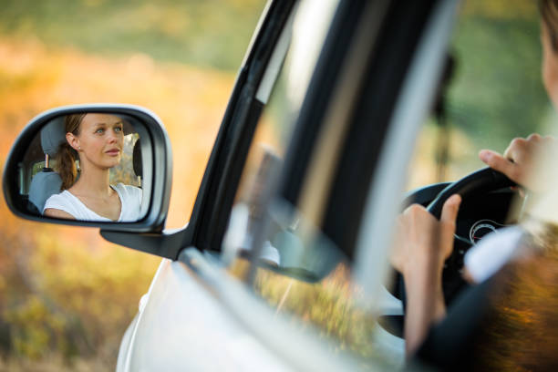 istock Pretty, young woman  driving her car 865628548