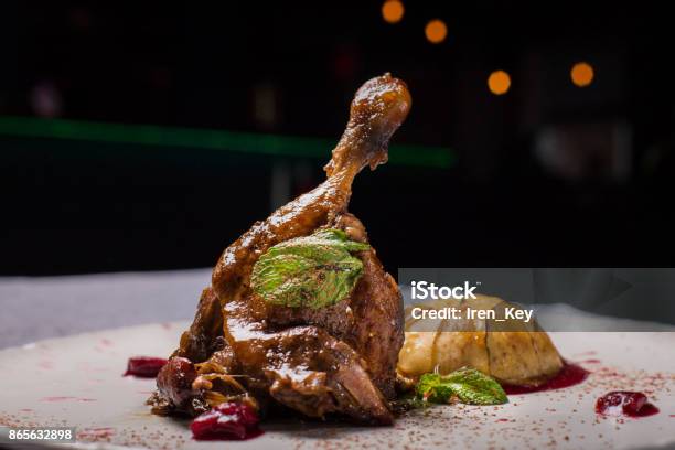 Duck Leg With Fruit A Tasty Dish In The Restaurant Stock Photo - Download Image Now