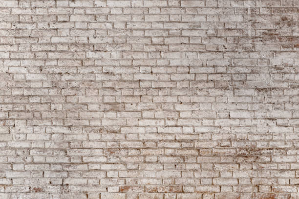 istock Background of old vintage dirty brick wall with peeling plaster 865636310