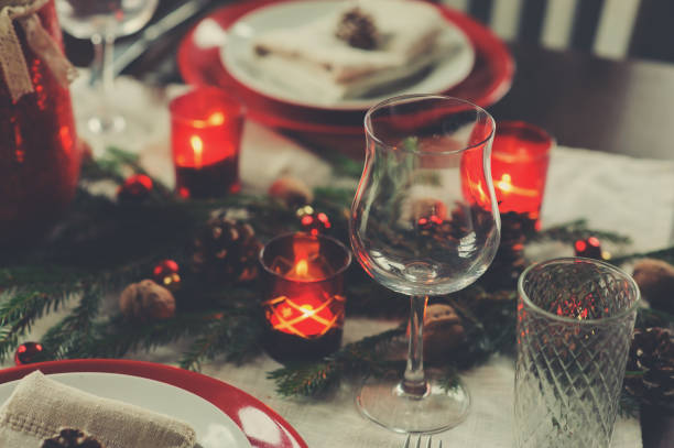istock Table setting for celebration Christmas and New Year Holidays. Festive traditional red and green table at home with rustic details 865640362