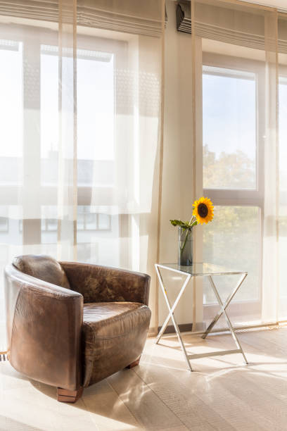 istock Cozy living room with leather armchair 865648314