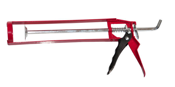 istock Manual caulking gun used for sealing cracks . Isolated on white 865648670