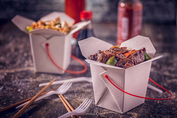 Szechuan beef Served with Rice as Take Out Food