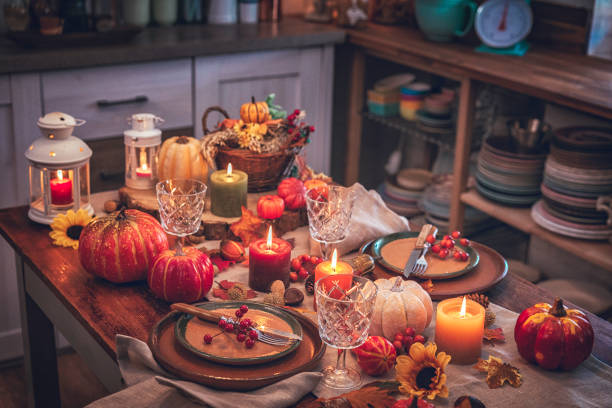 istock Decorated Table for Thanksgiving Dinner with Candles, Pumpkins, Leafs and Nuts 865655536