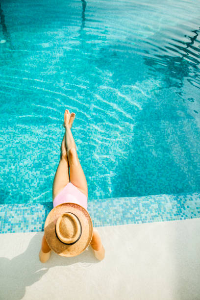 istock Woman by the pool 865656476