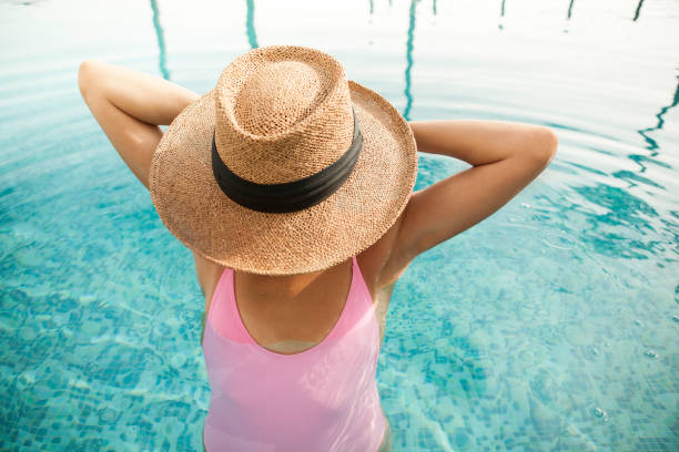 istock Woman by the pool 865656672