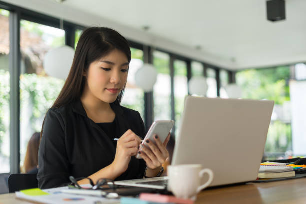 istock modern business woman working with smartphone in office 865658896