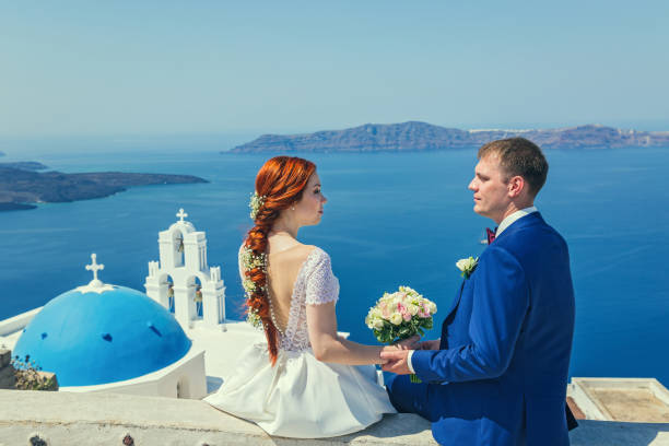 istock Wedding couple  watching the sea 865659062