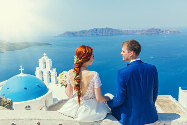 istock Wedding couple  watching the sea 865659096