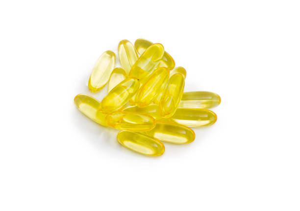 istock Pile of yellow capsules with dietary supplements 865660264