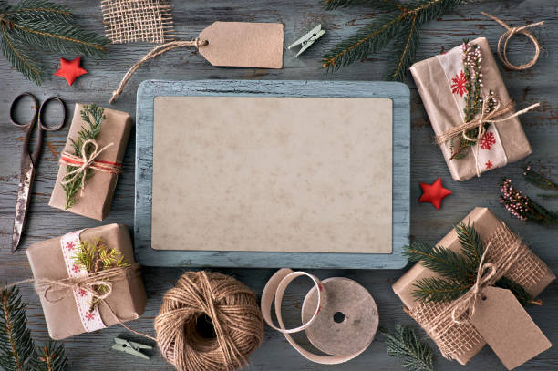 istock Hand crafted gifts on rustic wooden table with Christmas decorations, space 865660822