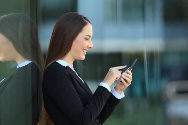 istock Profile of an executive using a phone on the street 865663302