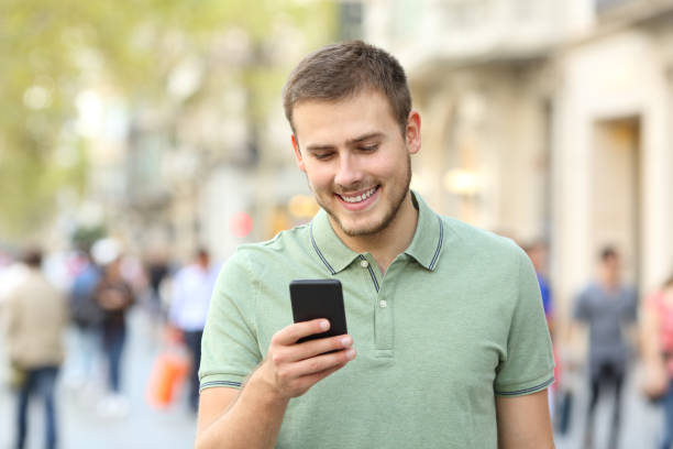 istock Front portrait of a man using a smart phone 865663560