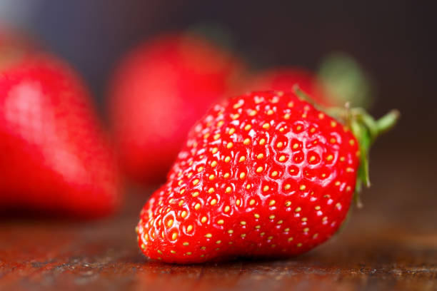 istock Strawberry on a wooden background 865664674